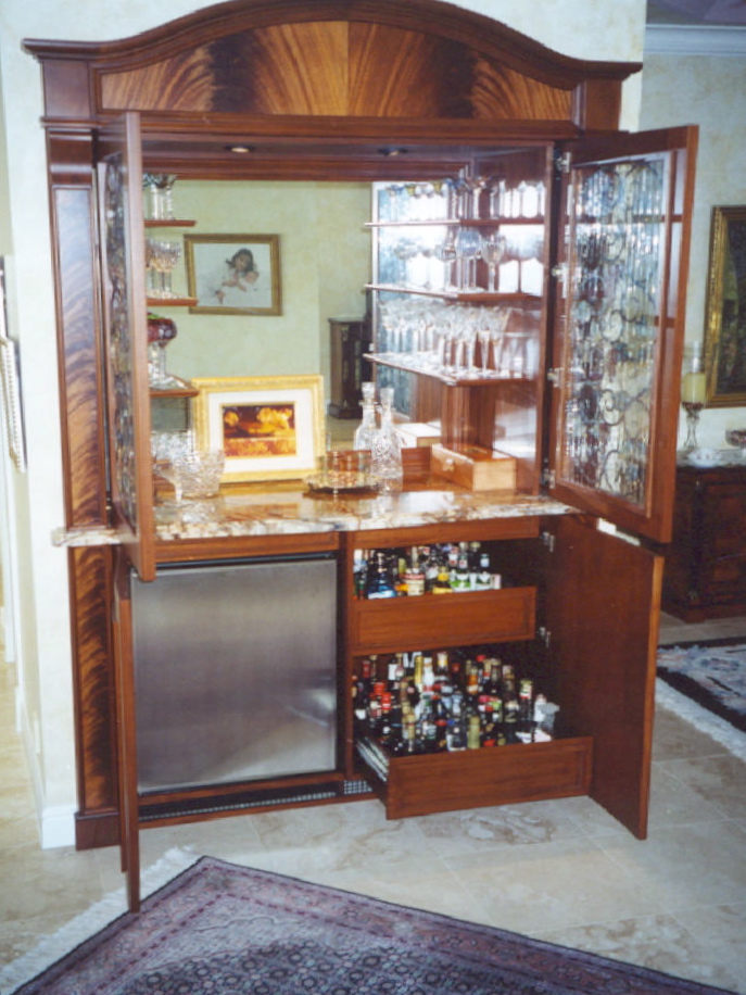 Crotch mahogany veneered bar, storage unit with leaded glass<br />upper doors - Sailfish Point