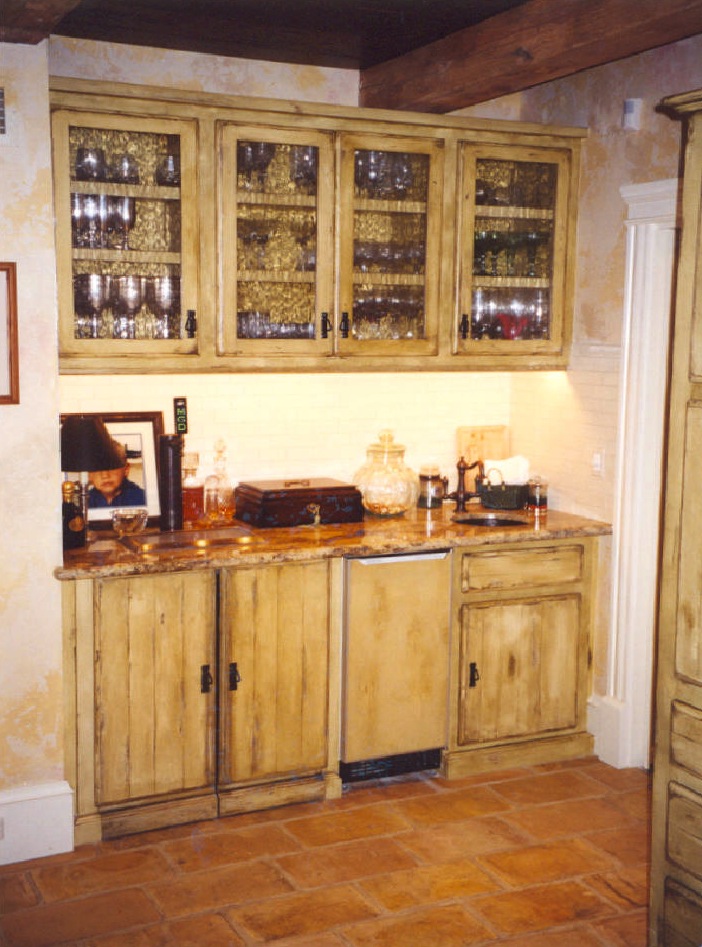 Antique finished bar area with decorative glass - Jupiter Island