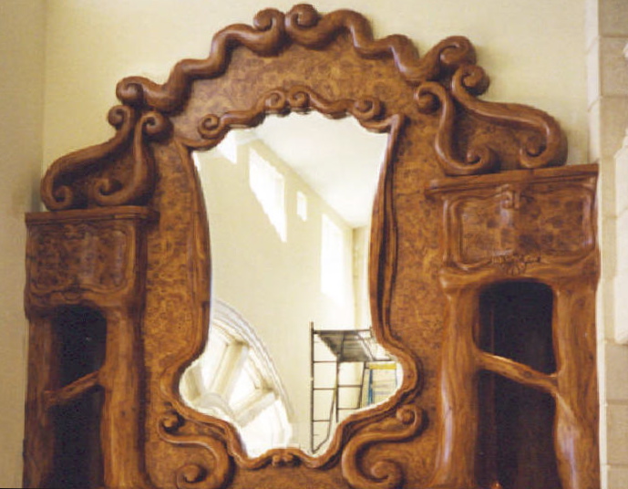 Carved mahogany/faux burl panels with half-round/radiused<br />niches with lighting, glass shelves, upper section - Sailfish Point