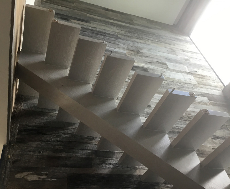Ash stair system with reclaimed barnwood walls - Nassau, Bahamas